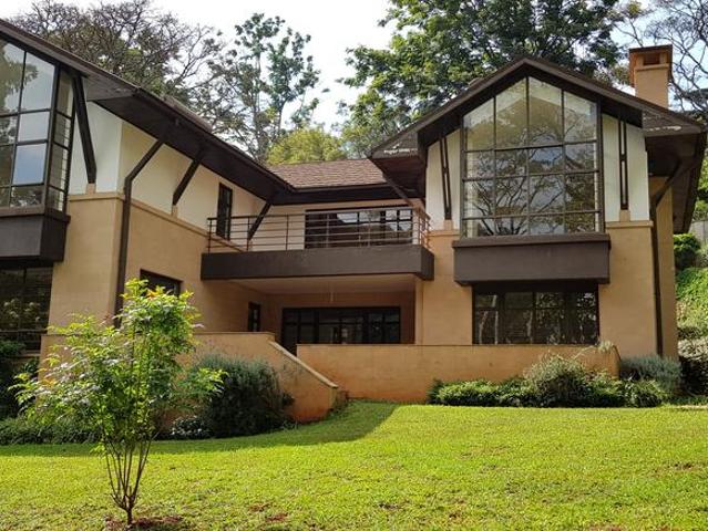 4 units, tucked away behind ingenious trees, sitting on half an acre of mature garden and pristine lawns With a forest scenic front view