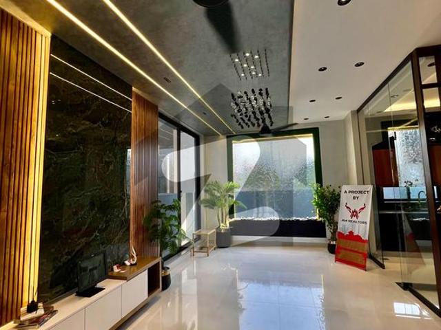 5 Marla Out Class Luxury Bungalow for Sale in DHA Phase 9 Town, Lahore! Prime Location Near Dolmen Mall & Defense Raya Golf Club. Just 3 KM from Ring Road & 5 KM from Airport. Modern Design with Swimming Pool! DHA 9 Town