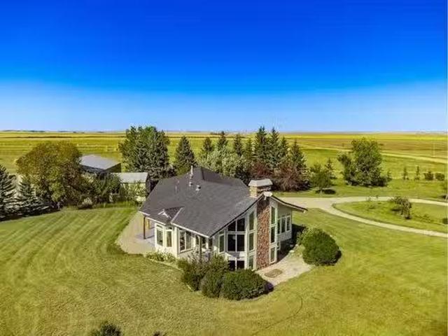 610107 184 Street East, Rural Foothills County, AB, T1V 1M7.