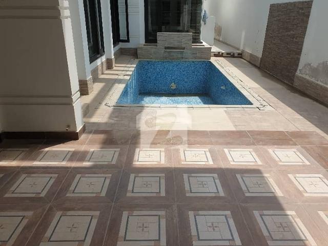 710 yards designers bungalow 6beds attached bath studay 3 kitchen 2 lounges drawing dinning bath servant room gazebo landscape garden