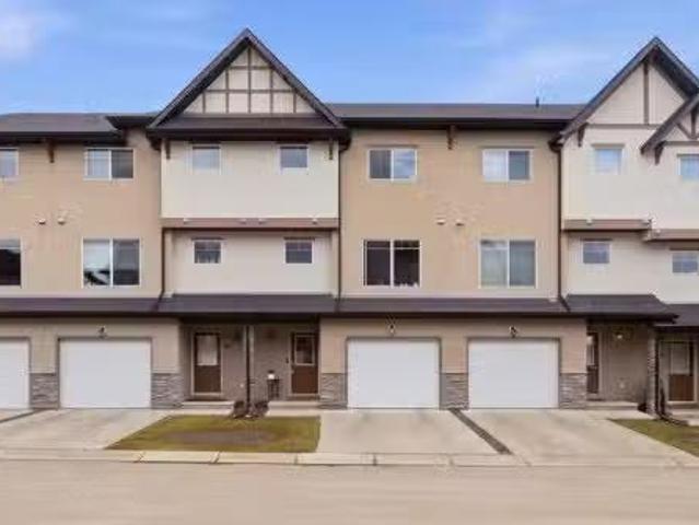 71 Cimarron Vista Gardens, Okotoks, AB, T1S 0G3 townhouse fo.