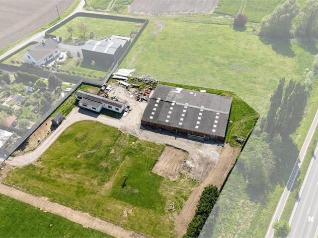 8230 m² grond te koop met een goedgekeurde bouwvergunning voor een alleenstaande woning