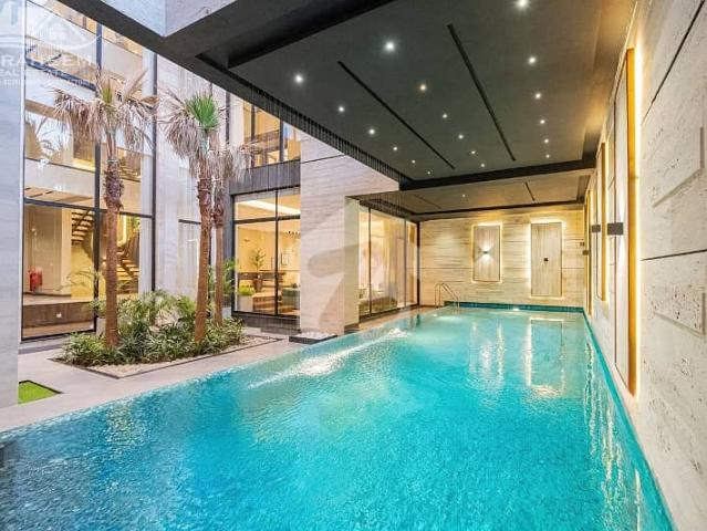 100% original add 30 marla full basement fully furnished ultra modern luxury bungalow with indoor swimming pool, home cenima, lift, rooftop and huge lawn for sale on 70 ft road in dha phase 8 near to park