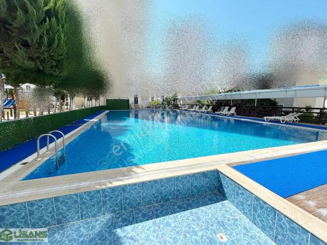 100.yılda site 2+1 geniş doğalgazlı çift banyo g.odalı havuzlu.