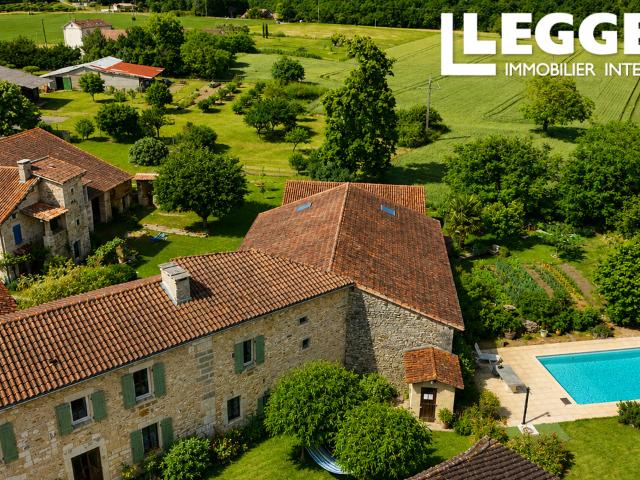 16th century house with inner courtyard, large barn, and swimming pool