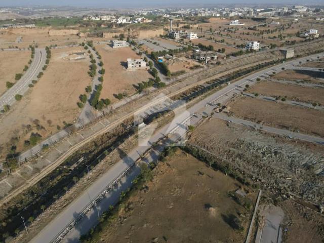1K zafar Iqbla Ave plot good location in starting number sec F, for sale DHA 5