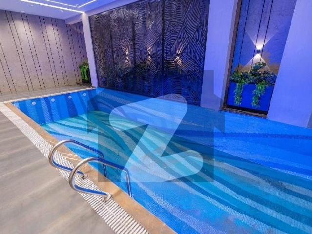 25 marla asad afzal design full basement ultra modern fully furnished bungalow with indoor swimming pool, home cenima, lift and double heighted tv lounge for sale in dha phase 5 near to park. DHA Phase 5