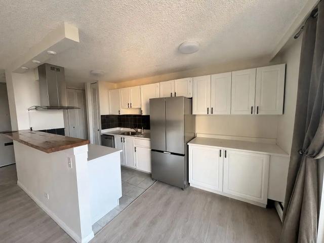 2 Bed / 2 Bath Condo – River View + Utilities & Underground Parking Included