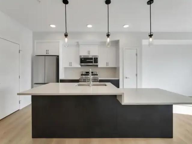 2 Bedroom Condo De Winton AB 104181106