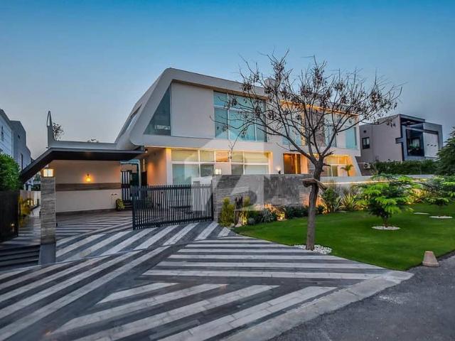 2 kanal elegant and fully maintained furnished bungalow with basement & swimming pool is available in the best block of dha lahore