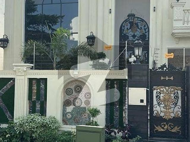 2 Kanal Elegant And Fully Basement Super Hot Located 100 wide road Kanal + 2 Bungalows Is Available In The Best Block Of DHA Lahore
