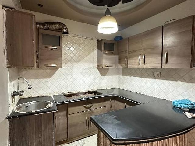 2bed d850 sq ft Gulshan iqbal block 2 West open Main road project Demand 95 lakh*Code 16855