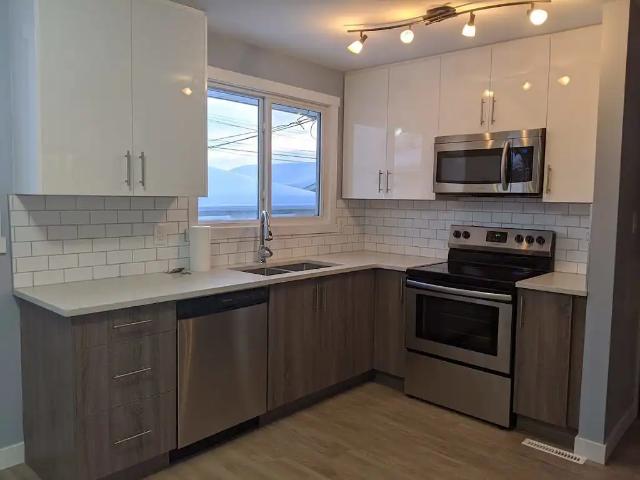 3 bed 1 bath renovated MAIN FLOOR utilities,garage,lawn/snow maint. Incl