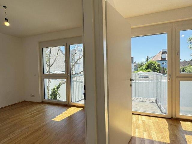 3 Zimmer Wohnung mit Balkon in Ruhelage – urbanes Wohnen am Kagraner Platz