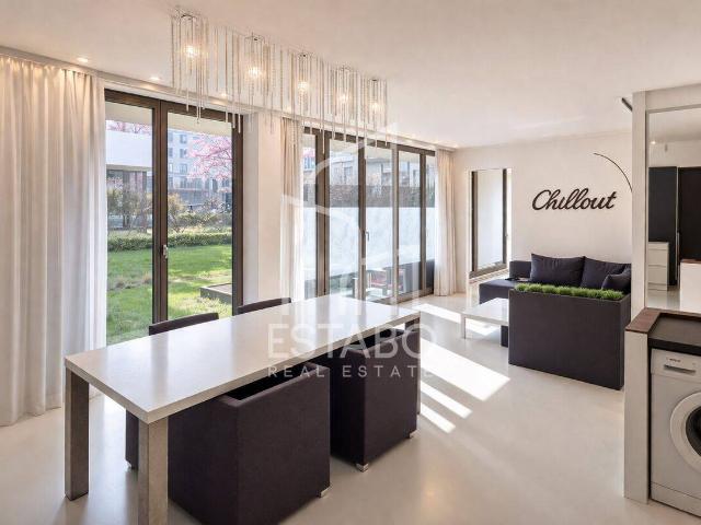 3 Zimmer Designwohnung mit TG Stellplatz, Südterrasse & 90 m² Garten in prämiertem Neubauensemble
