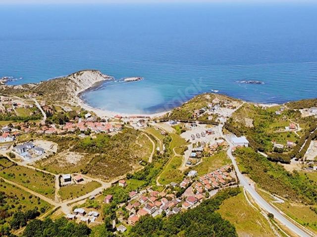 3K GYMDENİZ MANZARALIDENİZE YÜRÜME MESAFESİNDEİMARLI 718 M2
