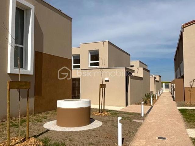 T2 avec jardin privatif et box en sous sol
