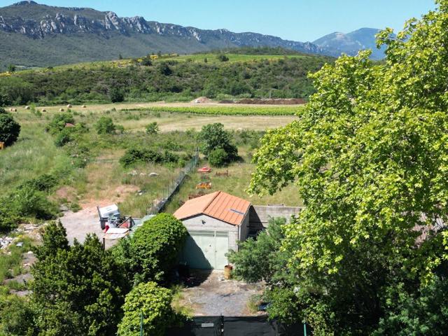Terrain avec bâtisse