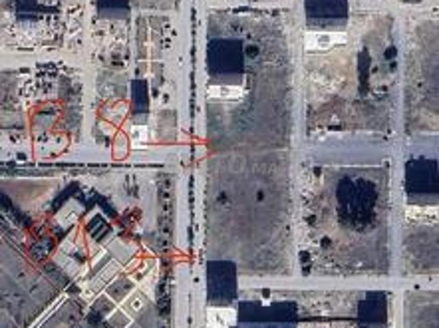 Terrain avec deux façades sur la rue principale