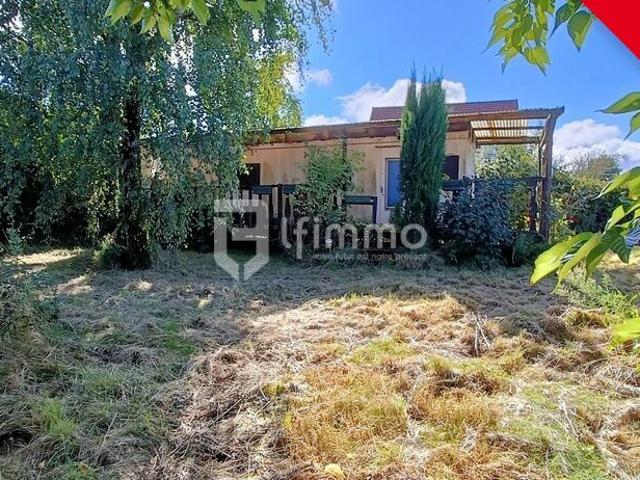 Terrain à bâtir avec caravane de 23m² viabilisé