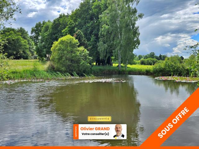 TERRAIN DE LOISIR AVEC ETANG PRAIRIE ET BATIMENT ENVIRONNEMENT CALME ET CAMPAGNE
