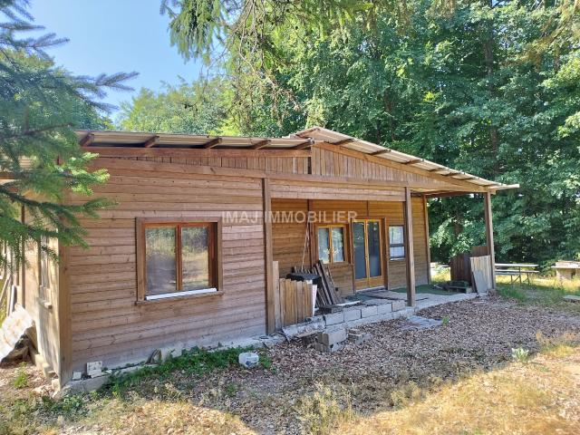 TERRAIN DE LOISIR BOISE DE 7000 m2 PROCHE EPINAL AVEC CHALET DE LOISIR A RENOVER