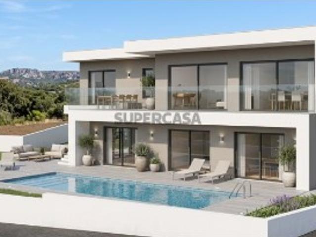 Terreno numa localização privilegiada de Santa Bárbara de Nexe, com um projeto aprovado, A CONSTRUÇÃO JÁ COMEÇOU. vista deslumbrante para o mar