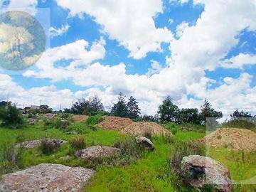 Terreno con frente a carretera