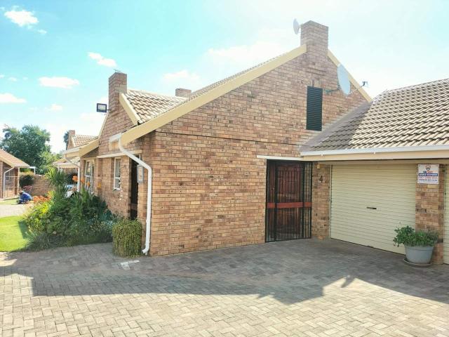 This beautiful corner unit with a double garage private garden In Langenhoven park is a must see