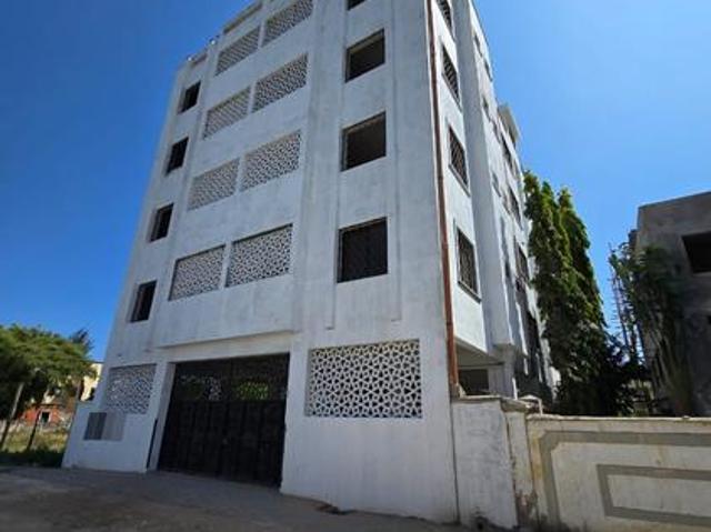 This listing is for a 2 bedroom apartment in the Baobab Apartment complex, located in Bamburi, Mombasa. The property is priced at *Kes. 4,500,000*, with a *50% deposit* required and the balance payable over *4 months