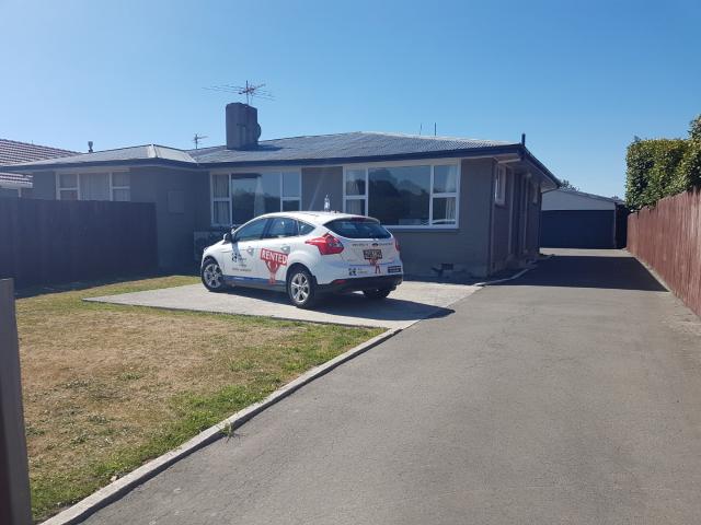 Three Double Bedrooms And Garaging In Great Location