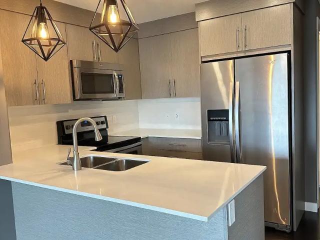 TOP FLOOR ONE BEDROOM + DEN UNFURNISHED