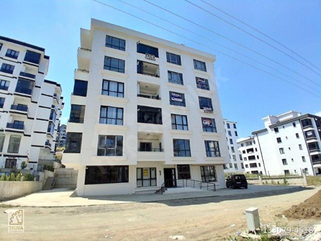 TRUVADAN KÖRFEZDE GENİŞ HOLLÜ DENİZ MANZARALI SATILIK 1+1 DAİRE
