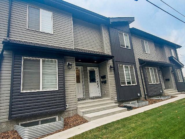 Turn key & Fully Rented Townhome With Legal Suites