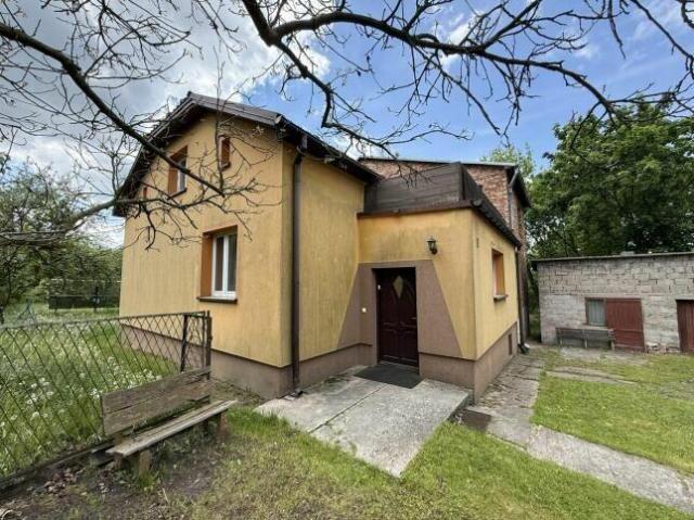 Udział 1/2 w dwóch domach z garażem