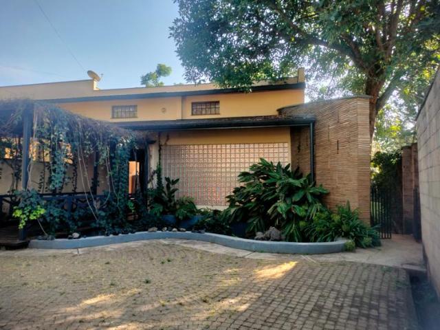 Unique architectural design 4 bedroom House on half acre with private swimming pool for