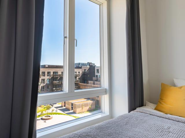 Værelse i moderne lejlighed på Sluseholmen