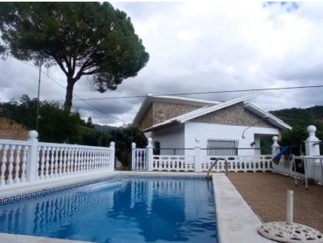 VENTA PARCELA CON CASA Y PISCINA