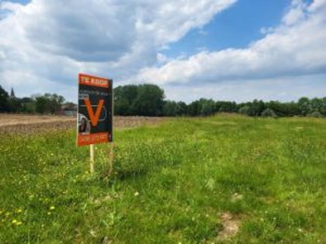 Vier bouwgronden voor halfopen bebouwing gelegen in het h.