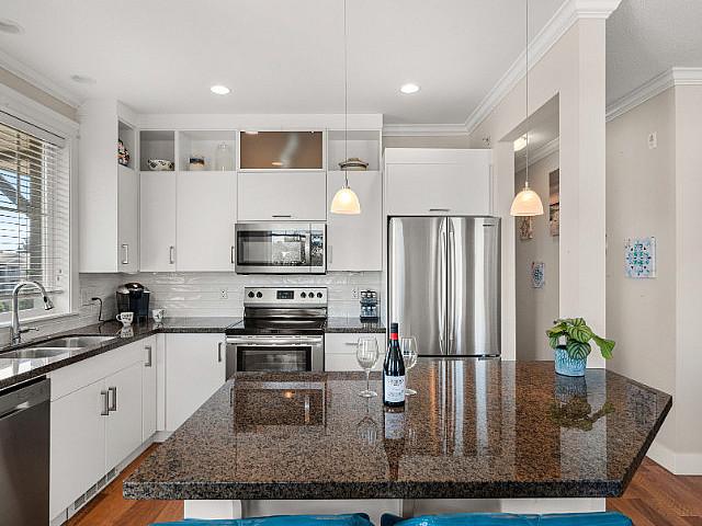 Walk To All Levels Of School From This Top Floor Corner Unit!