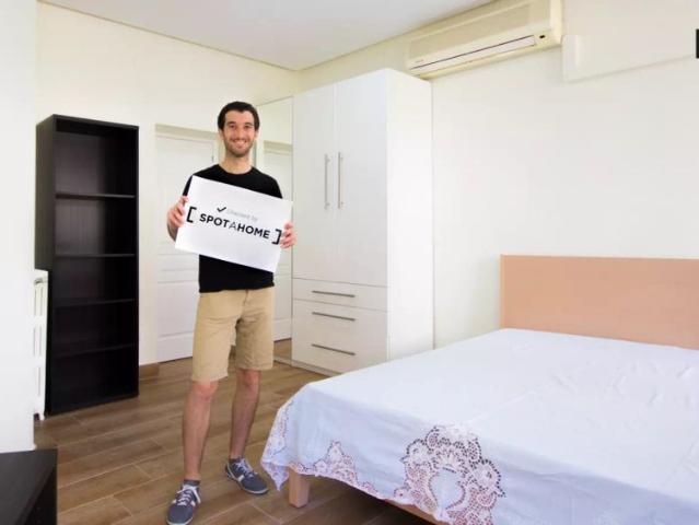 Welcoming room with window with street view in shared apartment, Moncloa