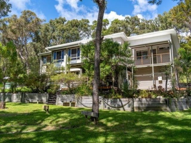 WHITE WAVE: DUAL LEVEL RESIDENCE WITH RENTAL INCOME POTENTIAL AT ORCHID BEACH