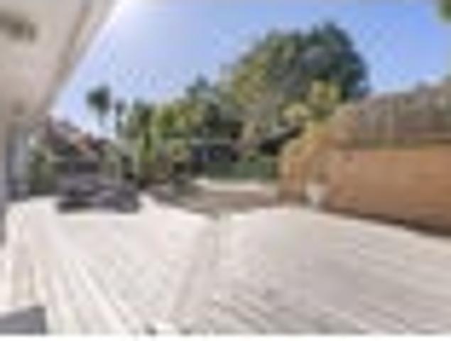 White Weatherboard Charm with a Showstopper Deck