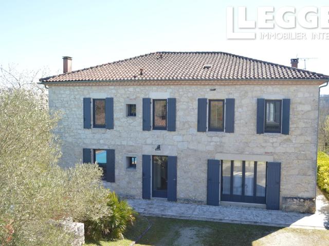 with unobstructed views of the hills, a beautiful stone property featuring a holiday cottage and a pool