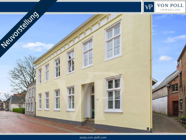 Wohnen mit Geschichte: Denkmalgeschützte Erdgeschosswohnung mit Terrasse & Carport in Weener