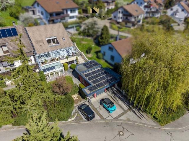Wohnen mit Weitblick: Exklusives Mehrfamilienhaus mit 3 Einheiten, Wintergarten & Traumterrassen