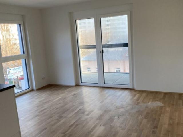 ZENTRALE 3 Zimmerwohnung mit gemütlicher Loggia, Tiefgaragenparkplatz und perfekter Anbindung