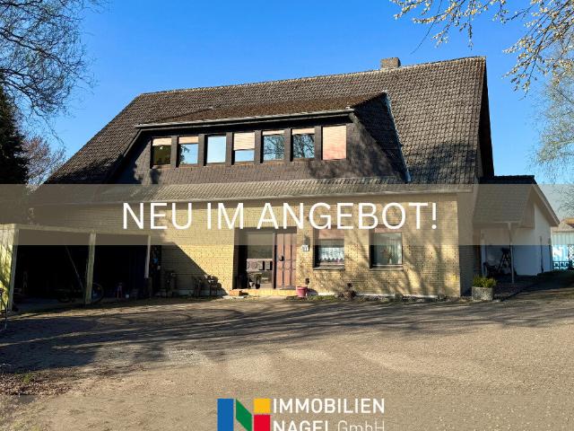 Vermietetes Zweifamilienhaus mit großzügigem Grundstück und Erweiterungsmöglichkeit