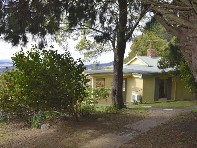 A charming lifestyle property with panoramic water views on 8+ acres, twenty minutes from Hobart CBD