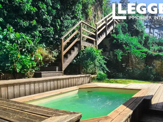 A deux pas du centre ville, appartement atypique avec terrasse, jardins et piscine